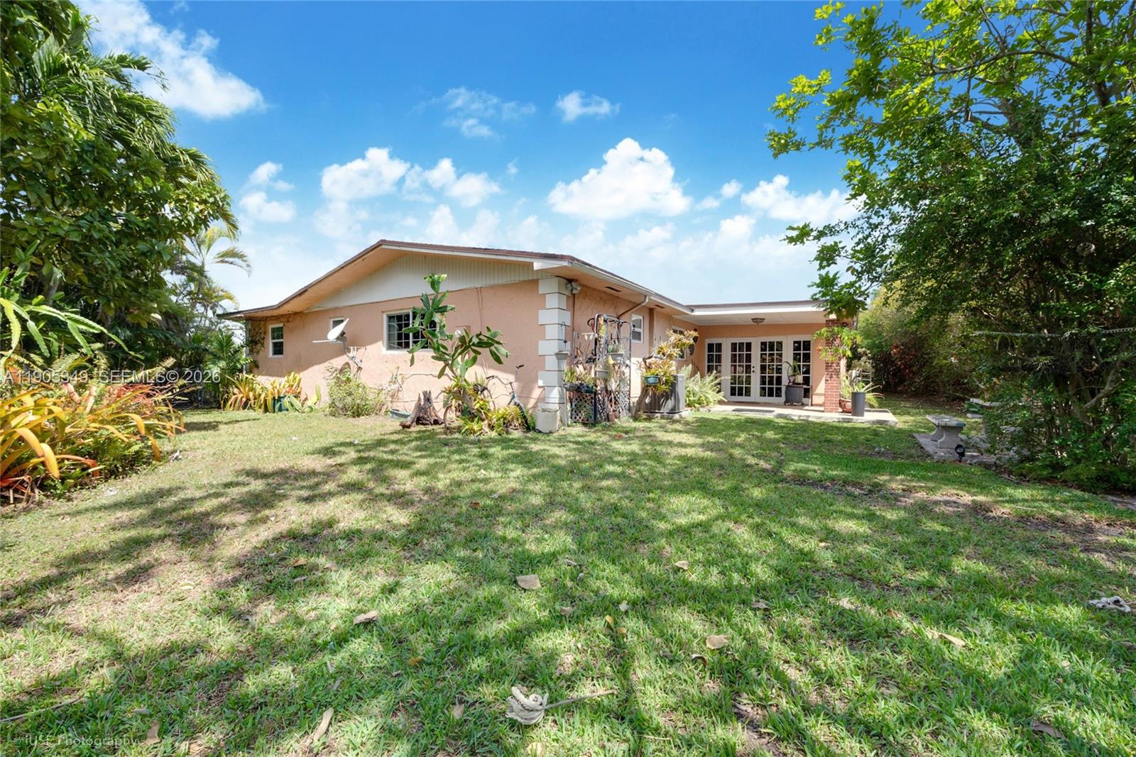 9500 Southwest 79th Street Miami, FL 33173 - Photo 18 of 19 a front view of a house with garden