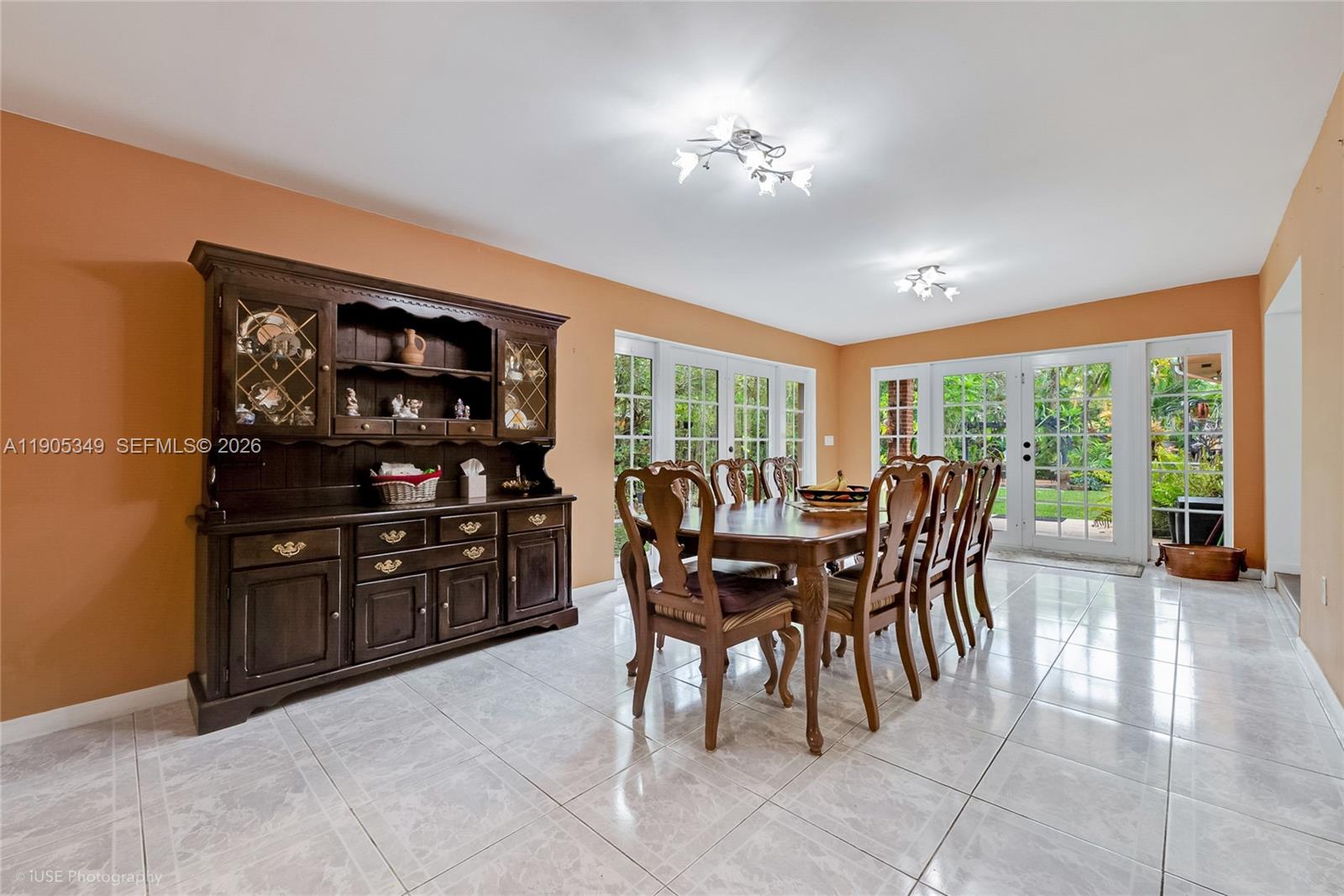 9500 Southwest 79th Street Miami, FL 33173 - Photo 6 of 19 a dining room with furniture and chandelier