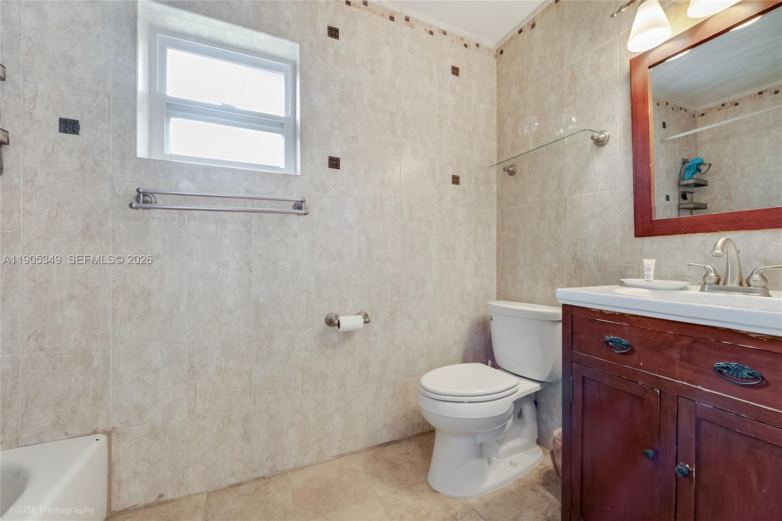 9500 Southwest 79th Street Miami, FL 33173 - Photo 9 of 19 a bathroom with a sink a toilet and shower