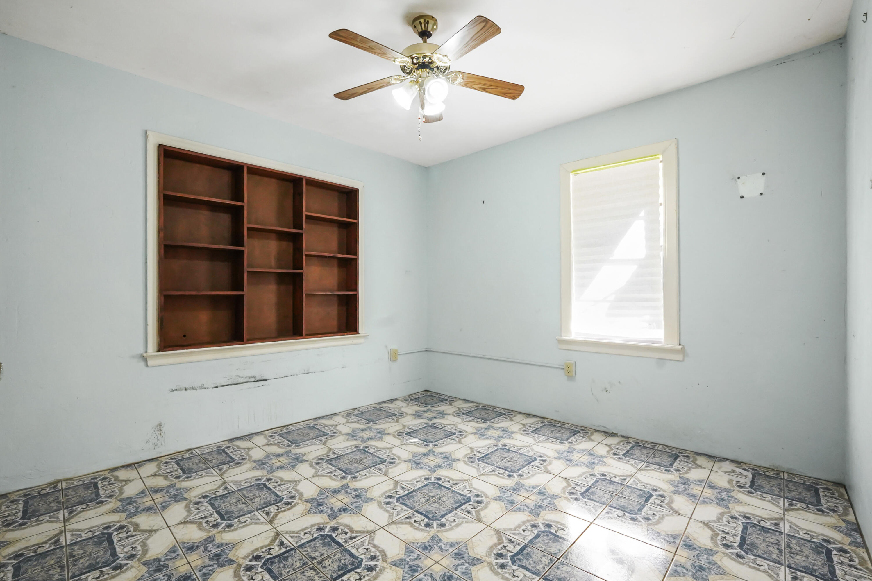 3858 Lakewood Road Palm Springs, FL 33461 - Photo 12 of 40 a view of a livingroom with a chandelier fan and a window
