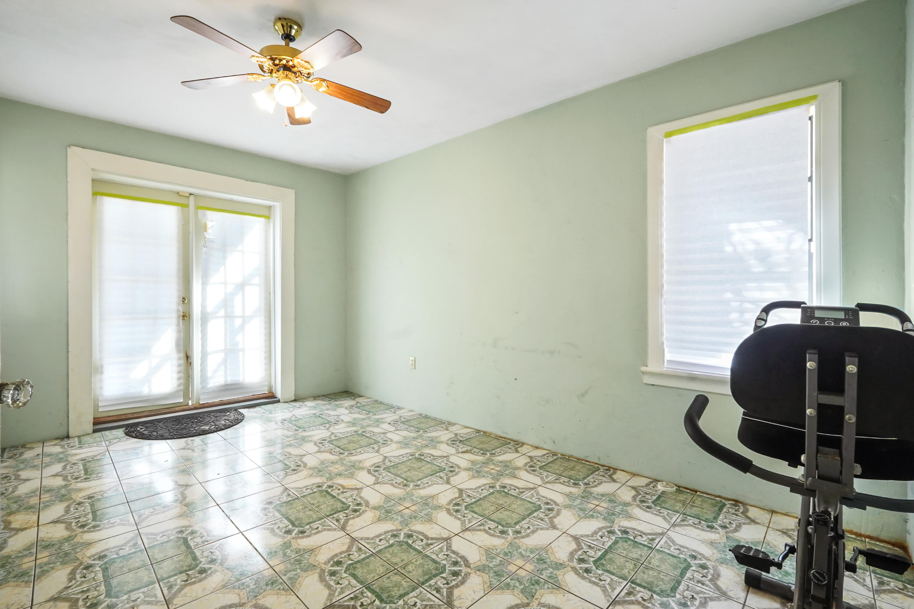 3858 Lakewood Road Palm Springs, FL 33461 - Photo 14 of 40 a view of a workspace with furniture and a window