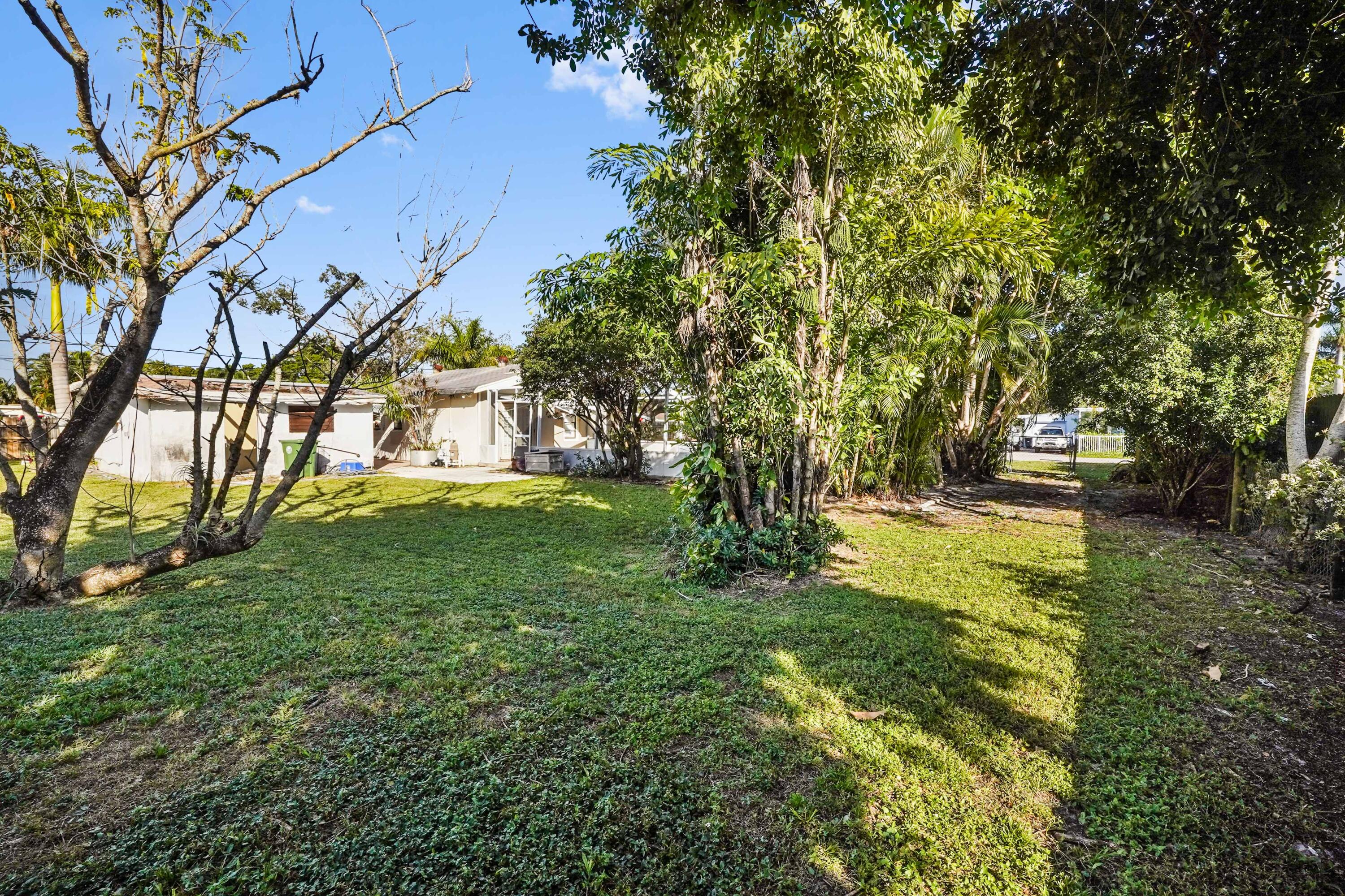 3858 Lakewood Road Palm Springs, FL 33461 - Photo 26 of 40 a view of yard with green space