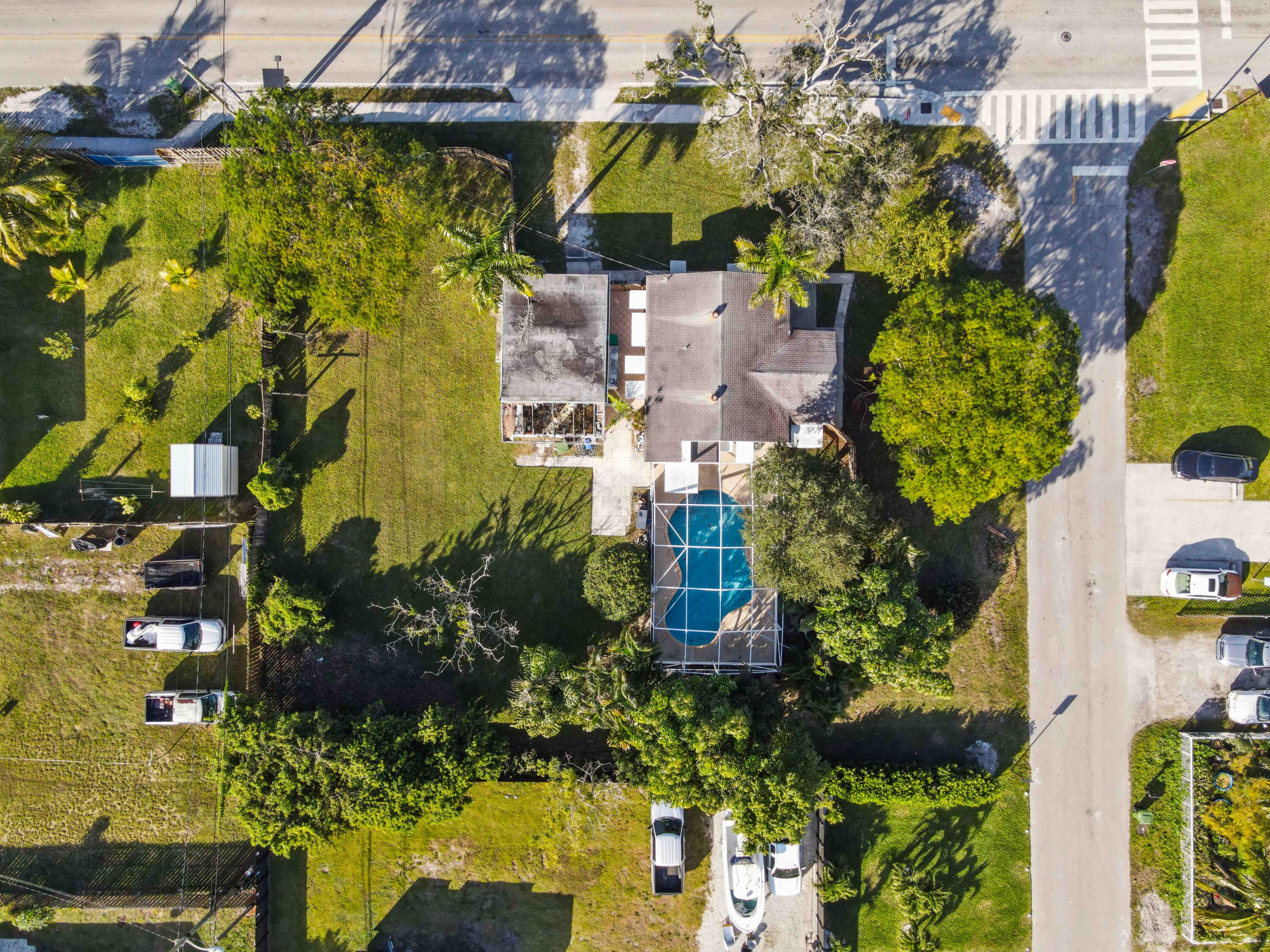3858 Lakewood Road Palm Springs, FL 33461 - Photo 30 of 40 an aerial view of residential houses with outdoor space