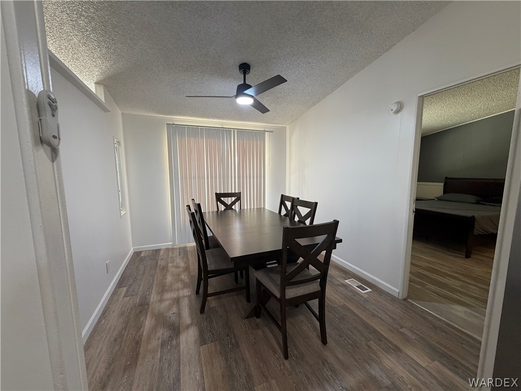 1910 Rio Grande Road Bullhead City, AZ 86442 - Photo 12 of 29 Dining area featuring wood-finish flooring and a contemporary ceiling fan