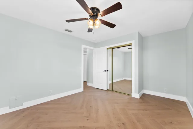 a kitchen with a sink a stove and cabinets