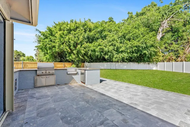 a view of a kitchen with an outdoor space