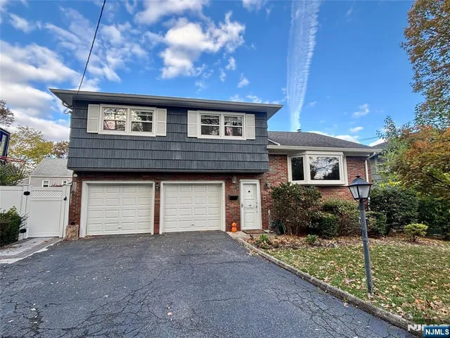a view of outdoor space with playground and green space