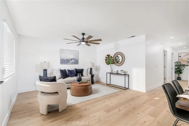 a living room with furniture and window