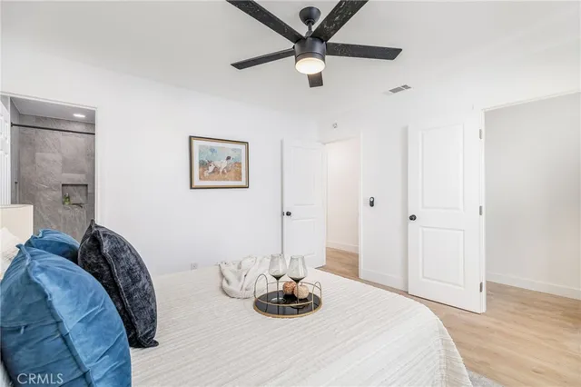 a bedroom with a bed and a table