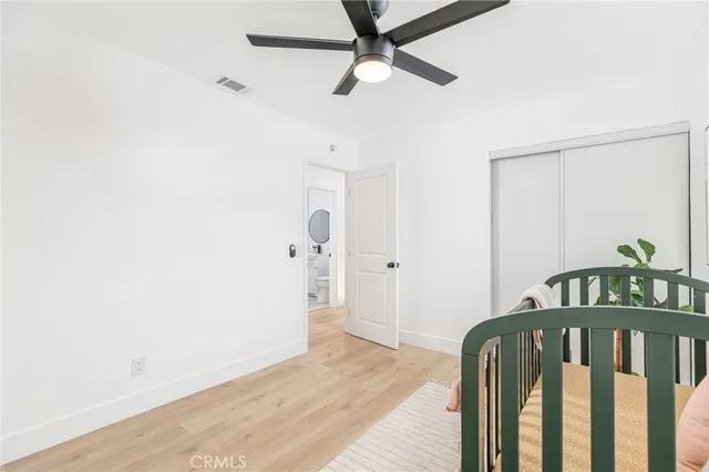 a view of hallway with wooden floor