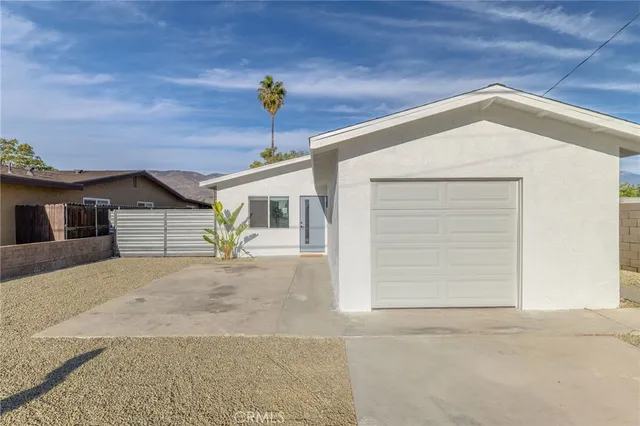 a front view of a house with a garage