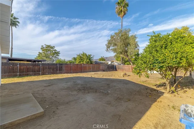 a view of yard with swimming pool
