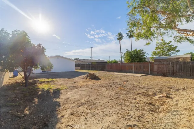 a view of a backyard of the house