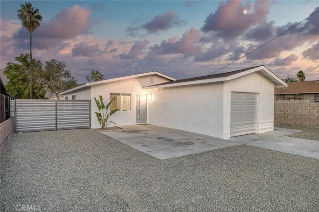a view of backyard and garage