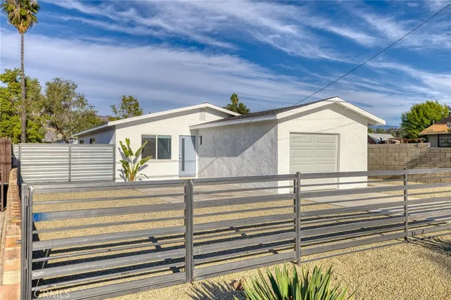 a front view of a house with a garage