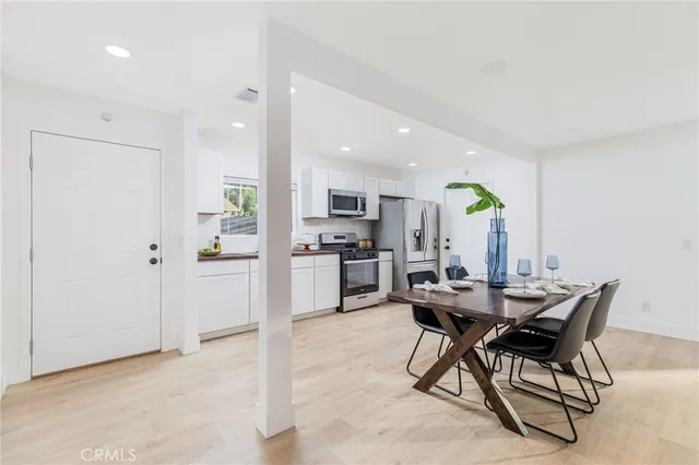 a kitchen with a table and chairs in it