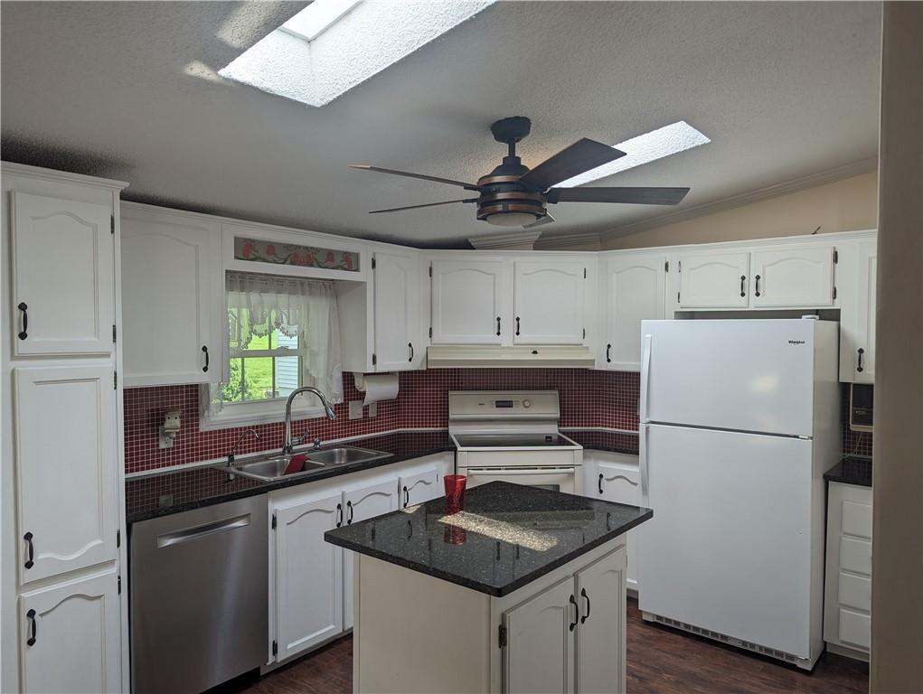767 Marianna Lone Pine Road Amity, PA 15311 - Photo 27 of 49 a kitchen with granite countertop a refrigerator a sink and white cabinets
