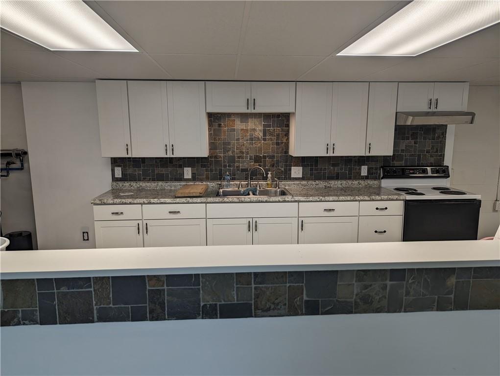 767 Marianna Lone Pine Road Amity, PA 15311 - Photo 32 of 49 a kitchen with stainless steel appliances a stove a sink and white cabinets