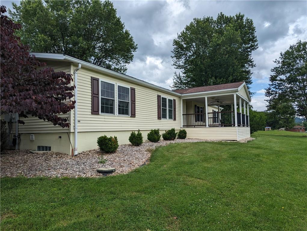 767 Marianna Lone Pine Road Amity, PA 15311 - Photo 5 of 49 a front view of house with yard and trees in the background