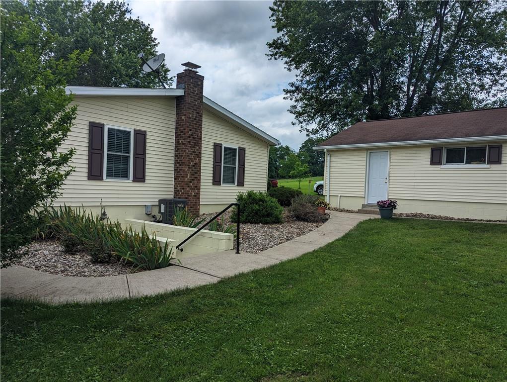 767 Marianna Lone Pine Road Amity, PA 15311 - Photo 8 of 49 a view of a house with a yard and plants