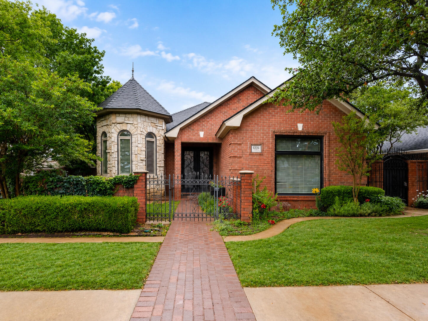 4226 97th Place Lubbock, TX 79423 - Photo 2 of 52 a front view of a house with a yard