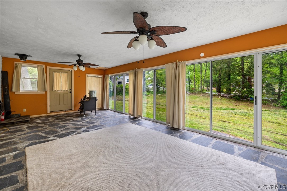 2811 Woodland Road Chester, VA 23831 - Photo 18 of 27 a view of a livingroom with a ceiling fan and a window