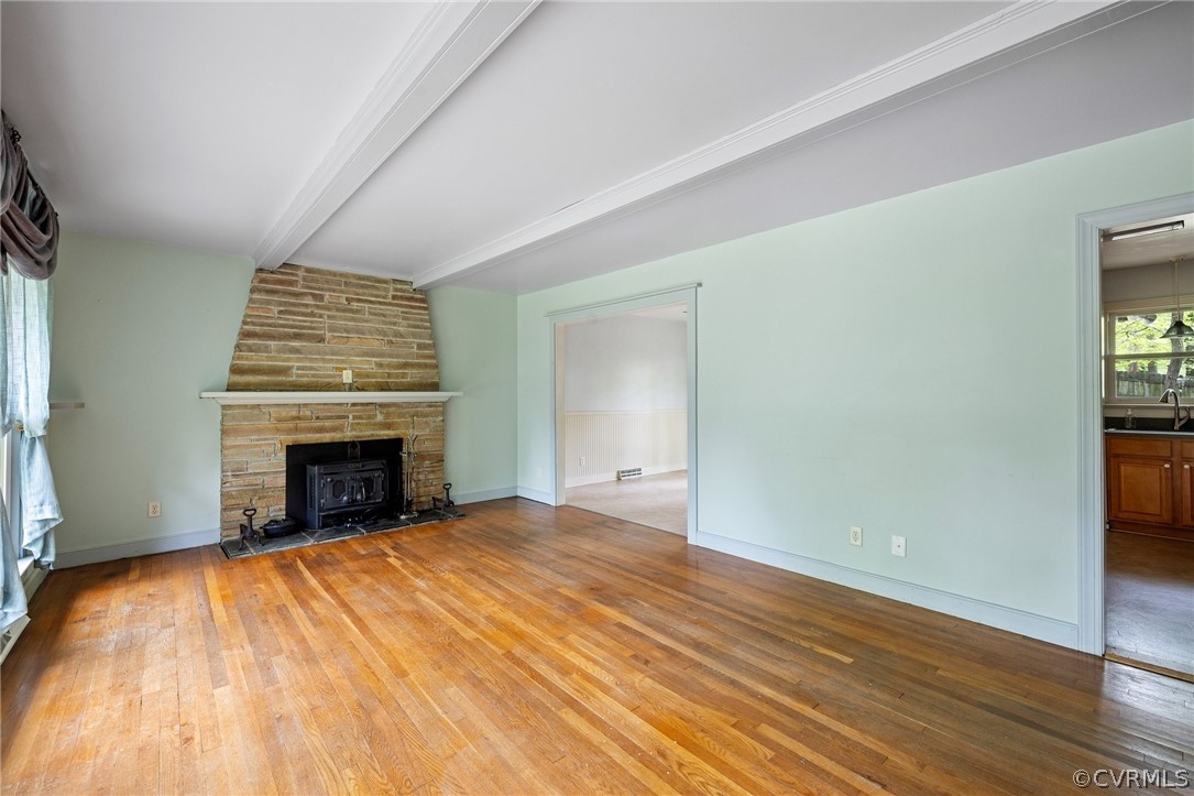 2811 Woodland Road Chester, VA 23831 - Photo 3 of 27 a view of an empty room with wooden floor and a fireplace