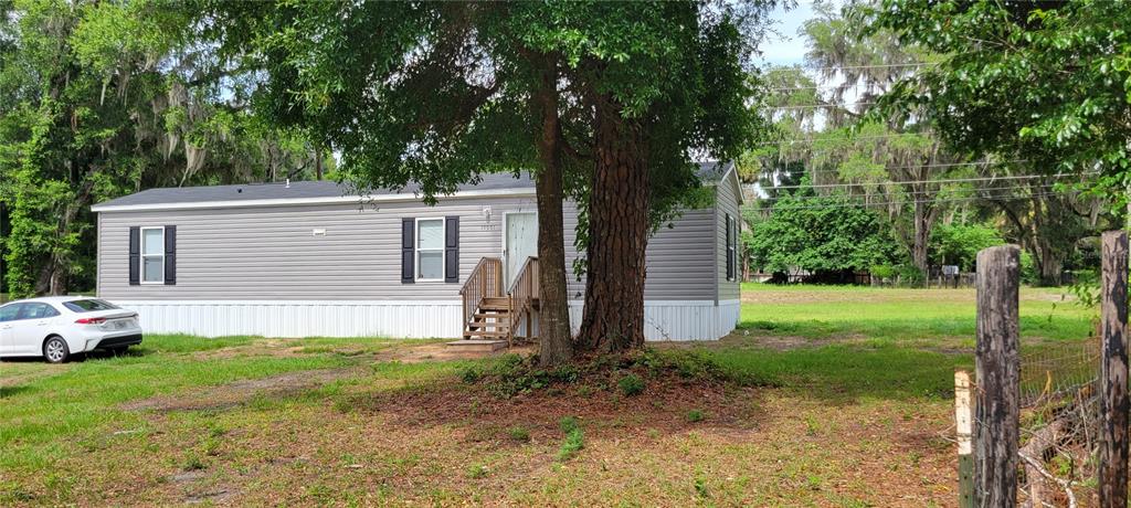 15951 Northwest 44th Ave Road Reddick, FL 32686 - Photo 1 of 1 a view of a house with a yard