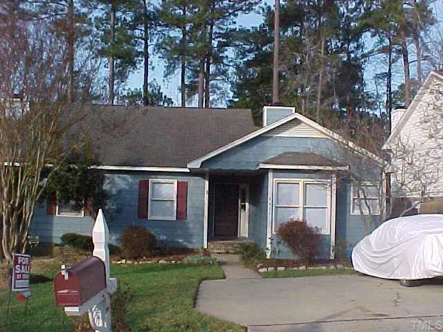 4411 Roller Court Raleigh, NC 27604 - Photo 1 of 1 a front view of a house with a yard