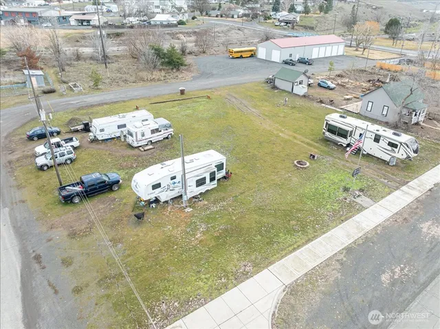 an aerial view of a house with yard