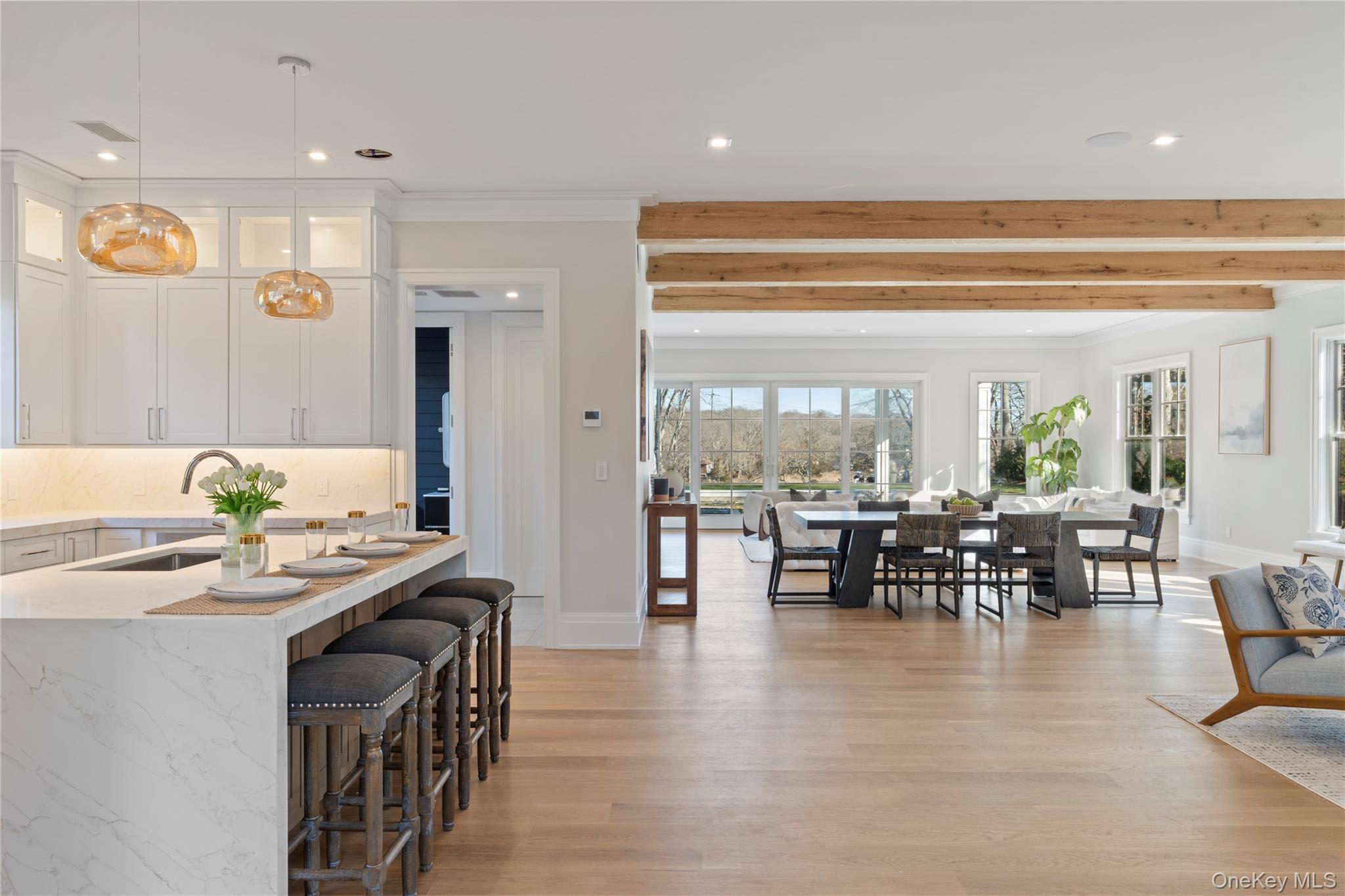 2590 Cox Neck Road Mattituck, NY 11952 - Photo 11 of 50 A light filled great room with walls of glass framing sweeping water views