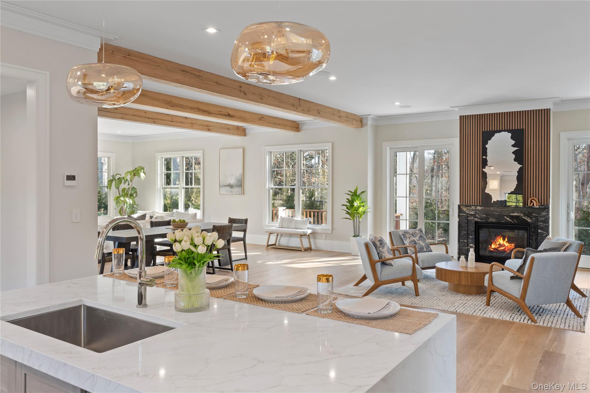 2590 Cox Neck Road Mattituck, NY 11952 - Photo 12 of 50 Elegant and functional, the kitchen anchors the home's open concept layout while offering elevated finishes and exceptional performance