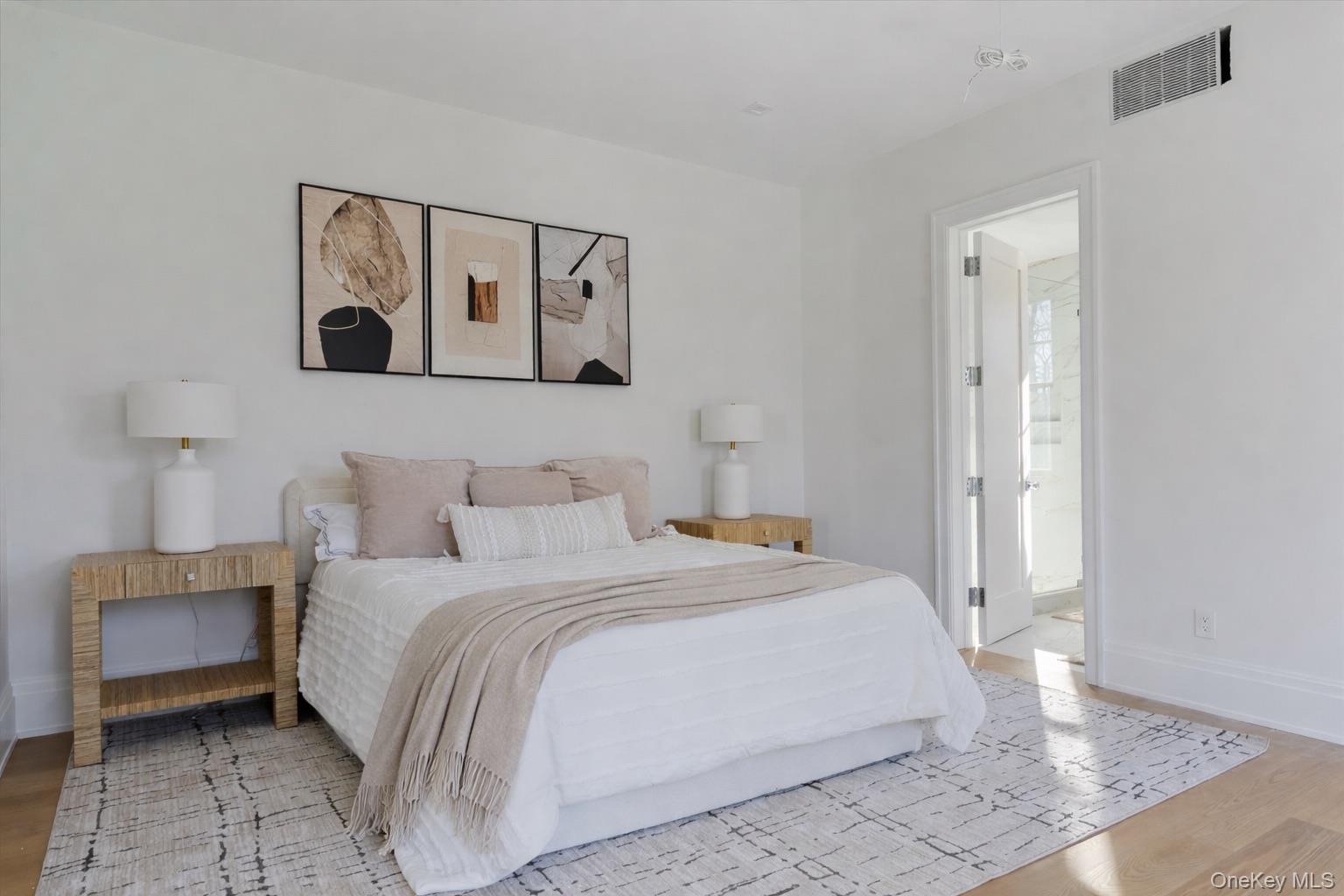 2590 Cox Neck Road Mattituck, NY 11952 - Photo 18 of 50 First floor junior primary ensuite thoughtfully designed providing comfort and privacy, finished with high-end materials and generous proportions