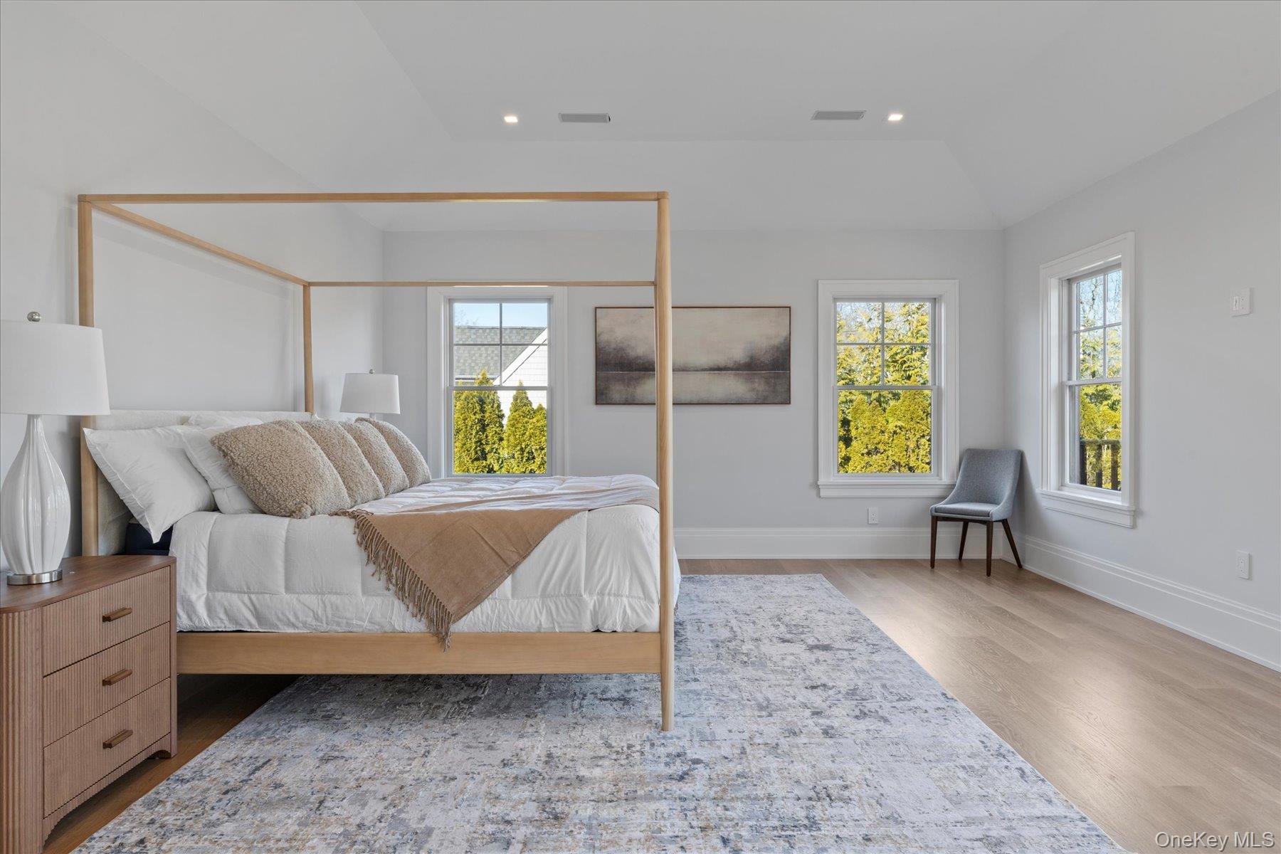 2590 Cox Neck Road Mattituck, NY 11952 - Photo 22 of 50 An expansive water view primary ensuite bedroom filled with natural light