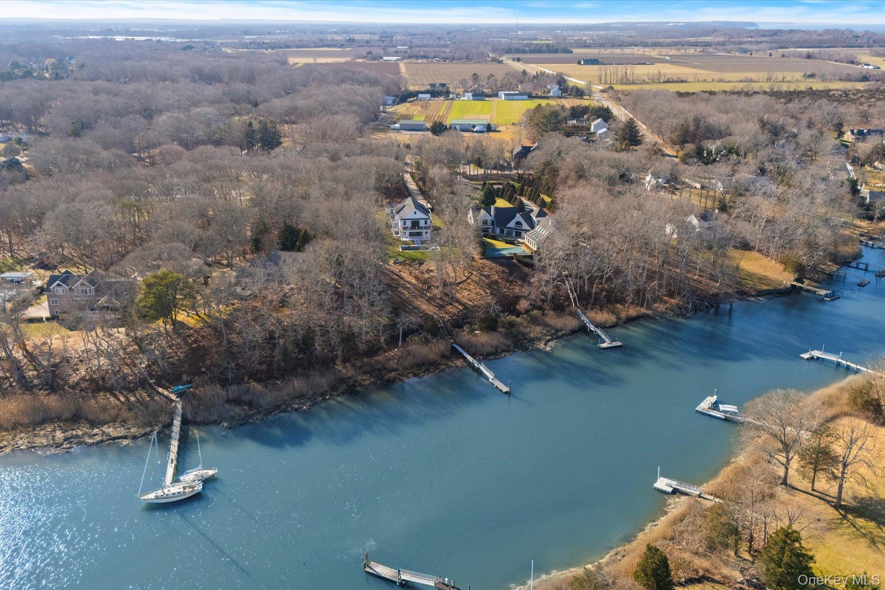 2590 Cox Neck Road Mattituck, NY 11952 - Photo 37 of 50 A bird's eye perspective showcasing the home's commanding waterfront position, expansive grounds and serene North Fork setting