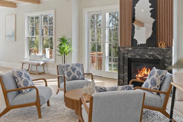 a lobby with furniture and a chandelier