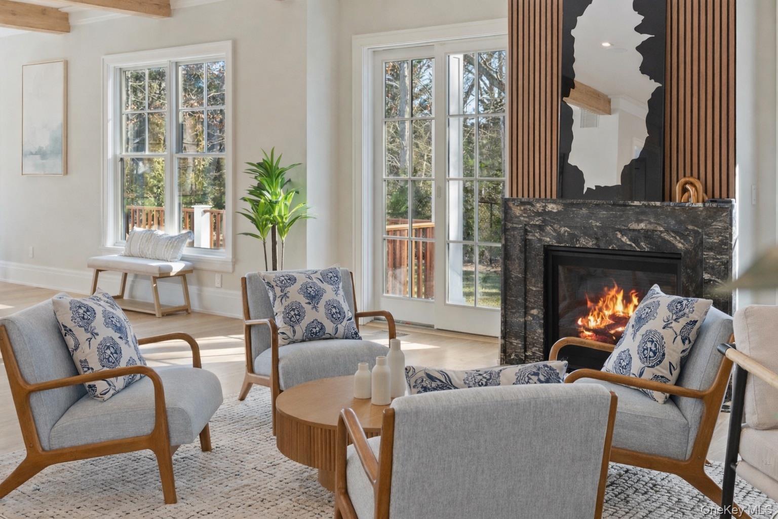 2590 Cox Neck Road Mattituck, NY 11952 - Photo 5 of 50 An inviting living space with an exquisite fireplace