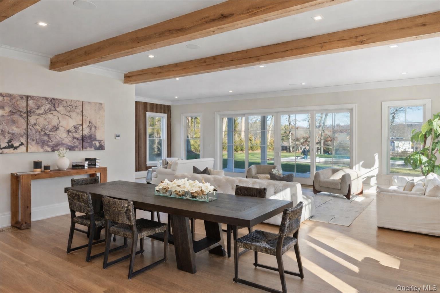 2590 Cox Neck Road Mattituck, NY 11952 - Photo 6 of 50 Seamless indoor-outdoor flow connects the great room, kitchen, and dining spaces, creating an airy light-filled environment