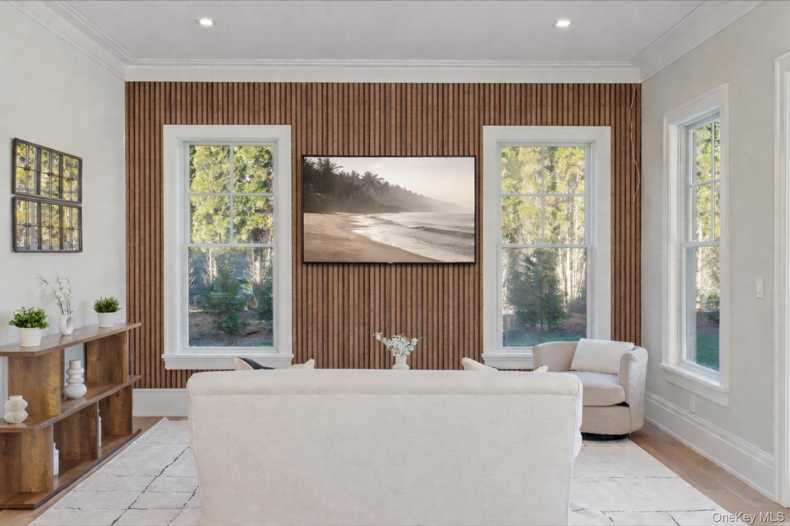 2590 Cox Neck Road Mattituck, NY 11952 - Photo 10 of 50 An inviting media room offering a cozy retreat from the main living areas while maintaining the home's elevated design aesthetic