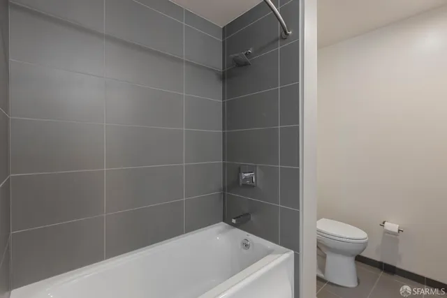 a bathroom with a bathtub and toilet