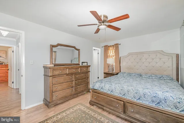 a living room with a bed and furniture