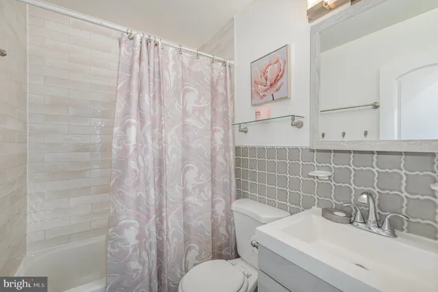 a bathroom with a sink and toilet