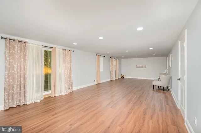 a view of a room with a wooden floor