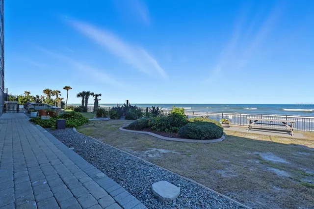 a spacious bedroom with a bed and a couch