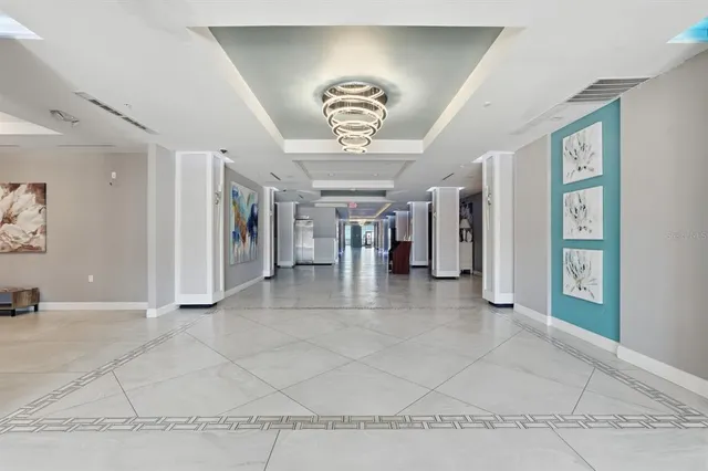 a view of an entryway with a chandelier