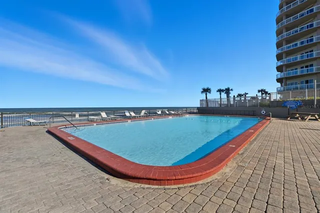 a view of a swimming pool with a chairs