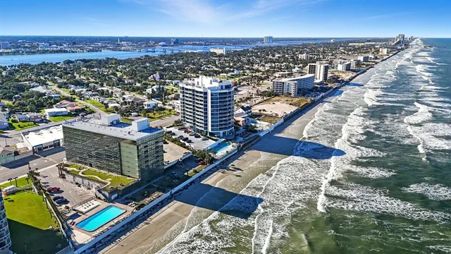 a bedroom with double bed and a large window