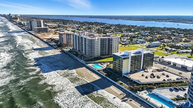 a bedroom with a bed and chandelier