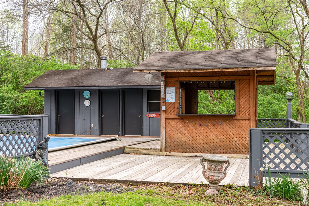 6750 Little Twin Road Germantown, OH 45327 - Photo 46 of 88 This private outdoor space features a charming cabana and expansive decking, ideal for relaxation and entertaining.