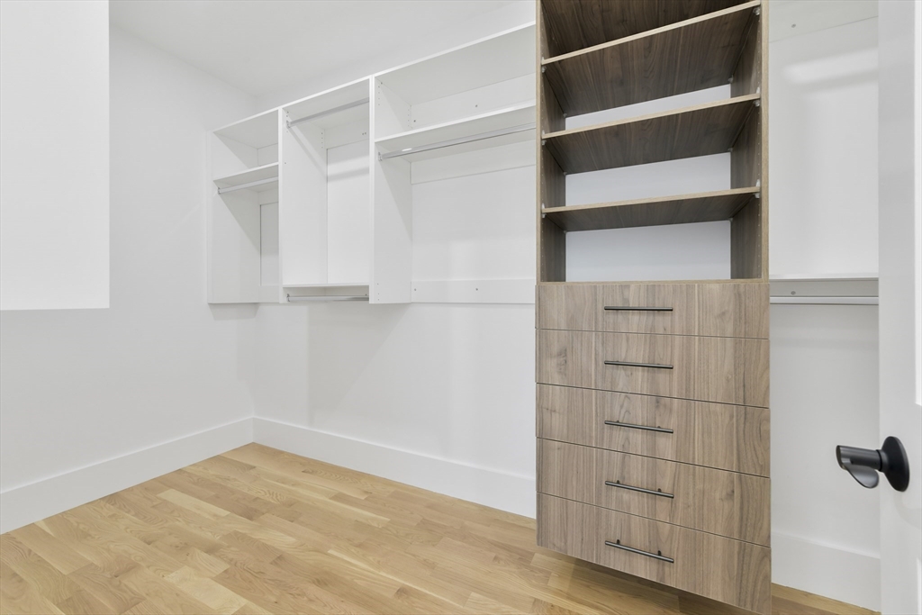 62 Brewster Drive Needham, MA 02492 - Photo 28 of 42 a view of walk in closet with empty racks
